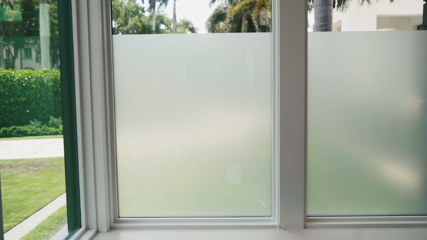 Privacy film finished across sliding glass doors and their frames